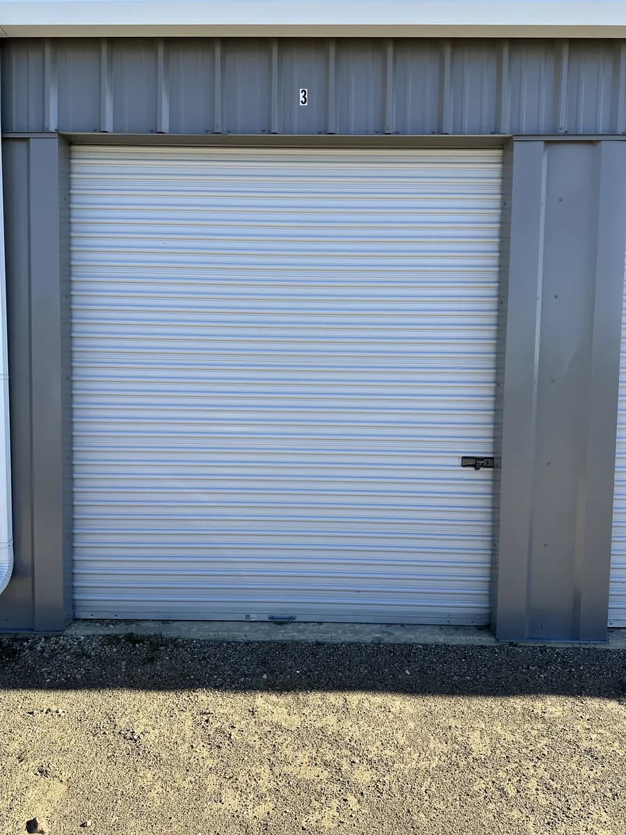 Bay 3, a 10×20 storage bay with its white roll-up door closed